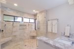 Master bathroom features dual vanities and large walk-in shower. There is more than enough room for everyone to get ready for the day